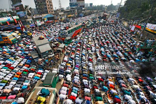 Muslims are praying on the road due to large number Muslims gathered at Bishaw ijtema at Tongi, Bangladesh . Bishaw Ijtema is the second largest...