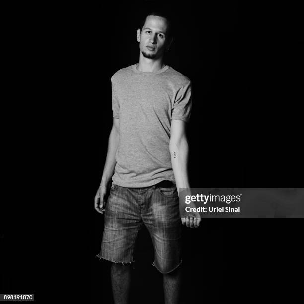 Daniel Philosoph grandson of Auschwitz survivor Livia Ravek is photographed on August 31, 2012 in Bnei Zion, Israel. Livia was tattooed with from the...