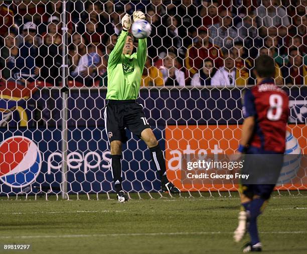 Pat Onstad of the Houston Dynamo saves a goal kick by Will Johnson of Real Salt Lake during the MLS game at Rio Tinto Stadium August 15, 2009 in...