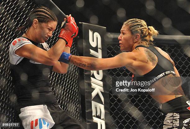 Cris Cyborg battles Gina Carano during their Middleweight Championship fight at Stikeforce: Carano vs. Cyborg on August 15, 2009 in San Jose,...