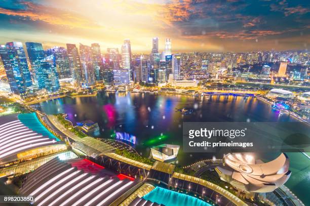 view of the skyline of singapore downtown cbd - merlion park singapore stock pictures, royalty-free photos & images