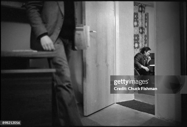 View, though an open door, of Polish trade-unionist Lech Walesa as he sits in his office at Solidarity headquarters, Gdansk, Poland, December 1980.