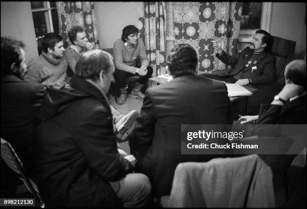 Polish trade-unionist Lech Walesa gestures, a cigarette in his hand, as he speaks to unidentified others during a meeting in his office at Solidarity...