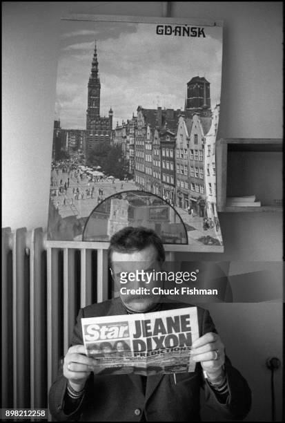 View of Polish trade-unionist Lech Walesa as he reads a newspaper clipping at a table in Solidarity headquarters, Gdansk, Poland, December 1980.