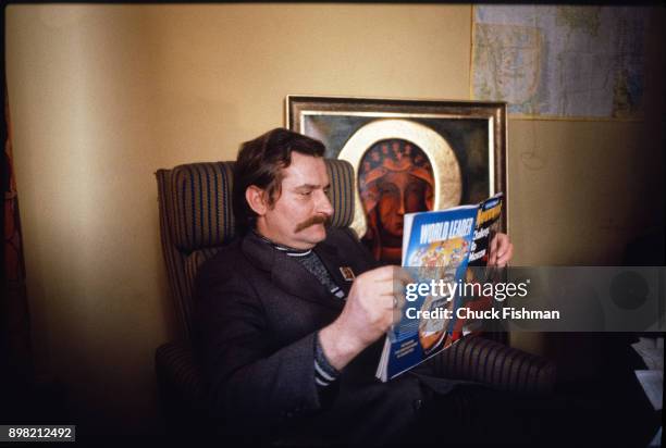 Polish trade-unionist Lech Walesa reads an issue of Newsweek magazine as he sits in his office at Solidarity headquarters, Gdansk, Poland, December...