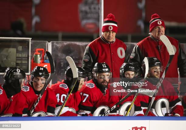 Ottawa Senators head coach Guy Boucher looks on from the bench in a game against the Montreal Canadiens during the 2017 Scotiabank NHL100 Classic at...