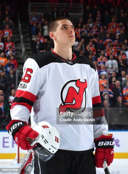 Steven Santin of the New Jersey Devils stands for the singing of the national anthem prior to the game against the Edmonton Oilers on November 3,...