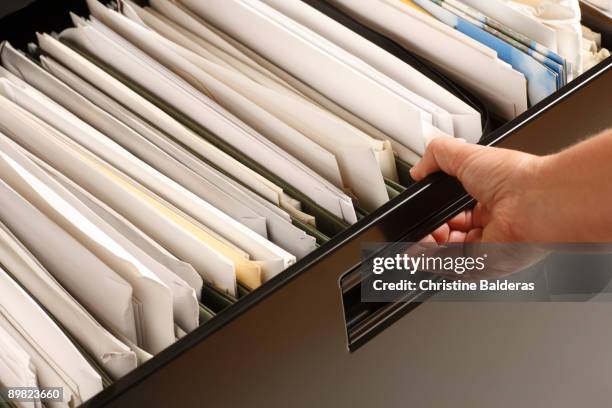 opening file cabinet - fille pull laine stock pictures, royalty-free photos & images