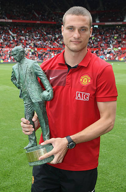 Nemanja Vidic of Manchester United poses with his Sir Matt Busby Player of the Year award ahead of the FA Barclays Premier League match between...