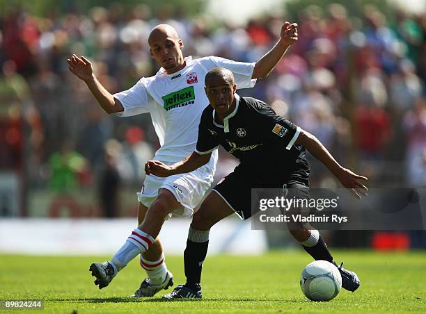 Nils-Ole Book of Ahlen and Sidney Sam of Lautern battle for the ball during the second Bundesliga match between Rot-Weiss Ahlen and 1. FC...