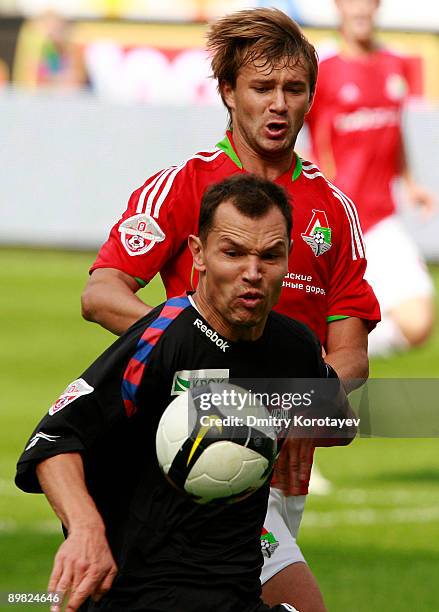 Dmitri Sychev of Lokomotiv Moscow battles for the ball with Sergei Ignashevich of CSKA Moscow during the Russian Football League Championship match...