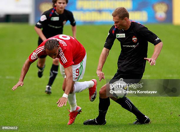 Peter Odemwingie of Lokomotiv Moscow battles for the ball with Aleksei Berezutskiy of CSKA Moscow during the Russian Football League Championship...