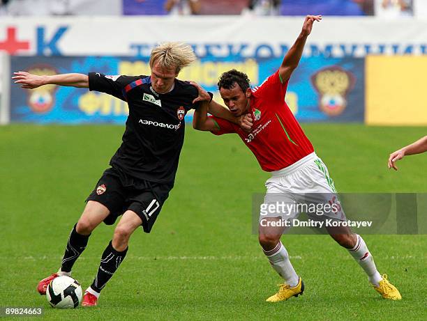 Charles of Lokomotiv Moscow battles for the ball with Milos Krasic of CSKA Moscow during the Russian Football League Championship match between...