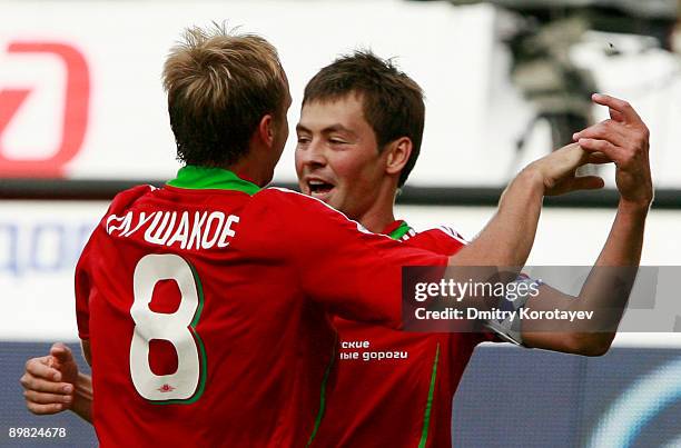 Denis Glushakov and Diniyar Bilyaletdinov of Lokomotiv Moscow celebrate after scoring a goal during the Russian Football League Championship match...