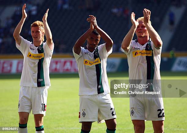 Marco Reus, Jean-Sebastien Jaures and Tobias Levels of Moenchengladbach celebrate the 2-1 victory after the Bundesliga match between Borussia...