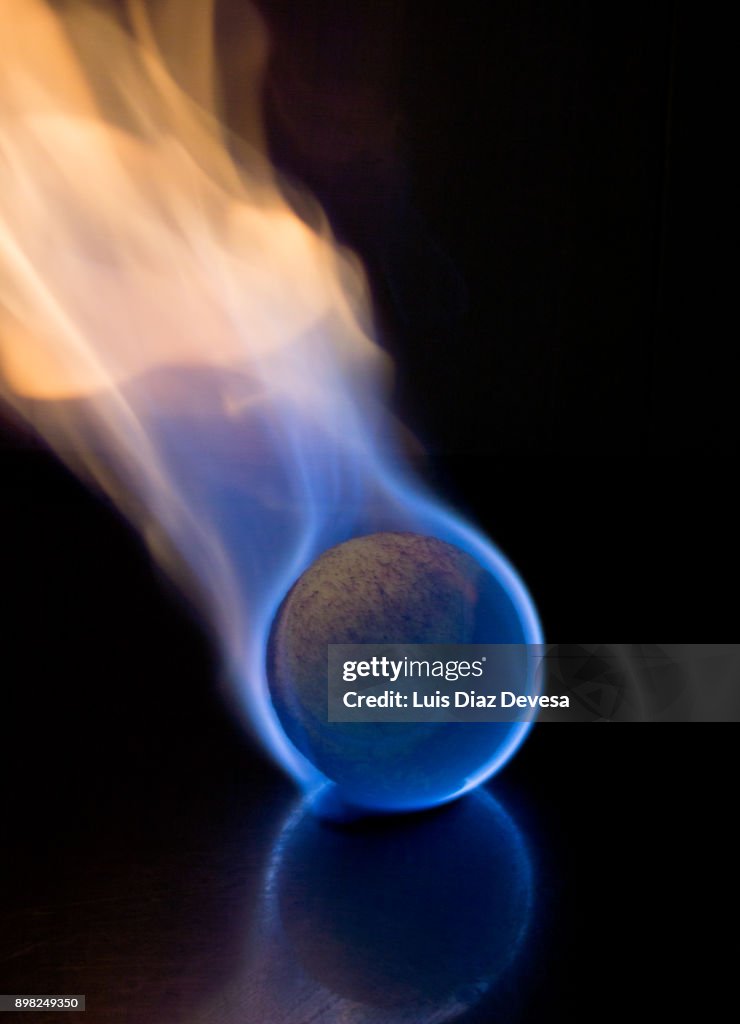 Tennis ball in flames