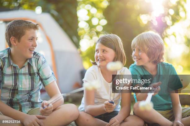 family camping trip - eating cajun food stock pictures, royalty-free photos & images