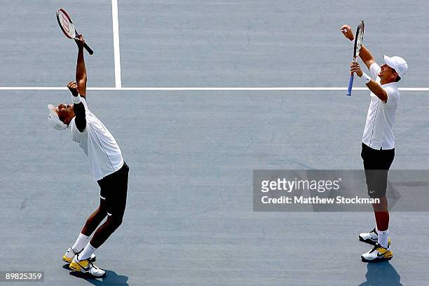 Mahesh Bhupathi of India and Mark Knowles of the Bahamas celebrate match point against Mix Mirnyi of Belarus and Andy Ram of Israel during the...