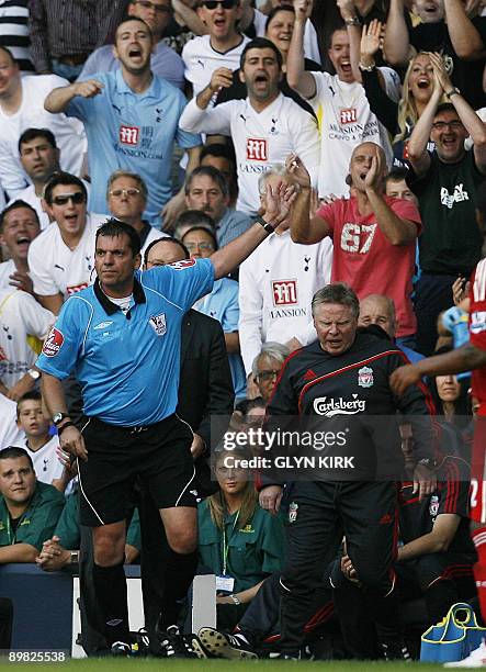 Liverpool's assistant coach Sammy Lee is sent off by Referee Phil Dowd during their Premier League match against Tottenham Hotspur at White Hart...