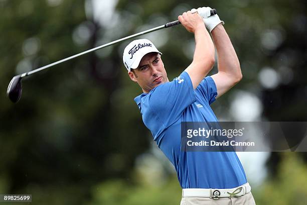 Ross Fisher of England hits his tee shot on the first hole during the final round of the 91st PGA Championship at Hazeltine National Golf Club on...