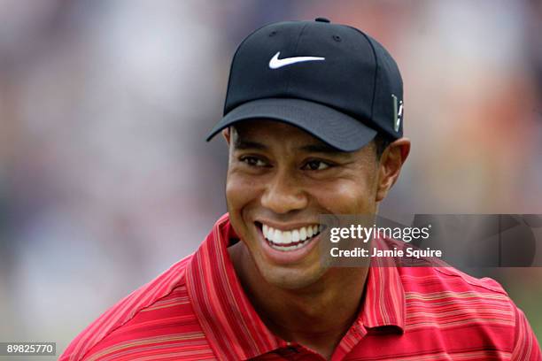 Tiger Woods laughs on the practice ground during the final round of the 91st PGA Championship at Hazeltine National Golf Club on August 16, 2009 in...