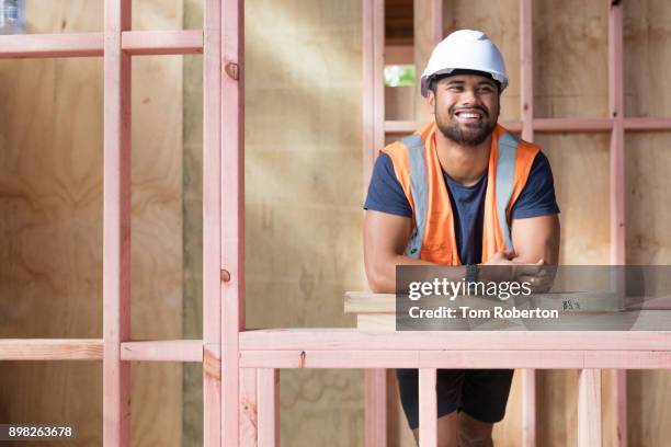 portrait of young maori builder on building site - leaning stock pictures, royalty-free photos & images