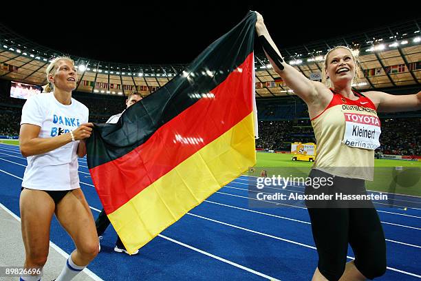 Jennifer Oeser of Germany and Nadine Kleinert of Germany celebrate during day two of the 12th IAAF World Athletics Championships at the Olympic...