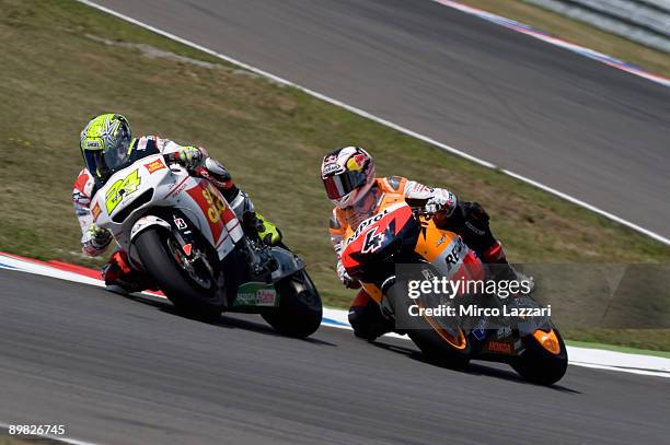 Toni Elias of Spain and San Carlo Honda Gresini leads Andrea Dovizioso of Italy and Repsol Honda Team during the MotoGP race in the MotoGP World...