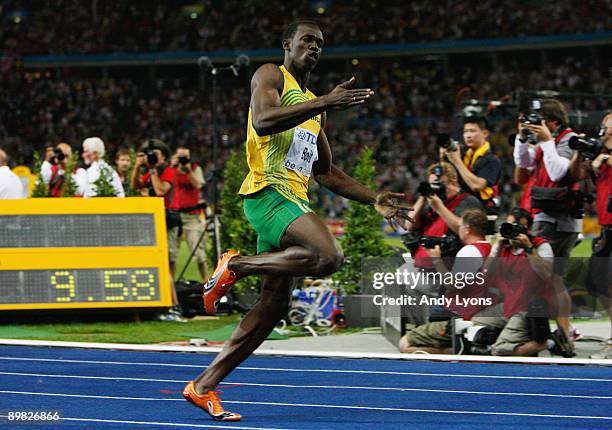 Usain Bolt of Jamaica crosses the line to win the gold medal in the men's 100 Metres Final during day two of the 12th IAAF World Athletics...