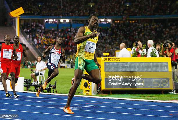 Usain Bolt of Jamaica crosses the line to win the gold medal in the men's 100 Metres Final during day two of the 12th IAAF World Athletics...