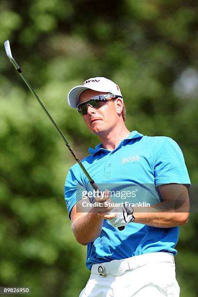 Henrik Stenson of Sweden watches his tee shot on the eighth hole during the final round of the 91st PGA Championship at Hazeltine National Golf Club...