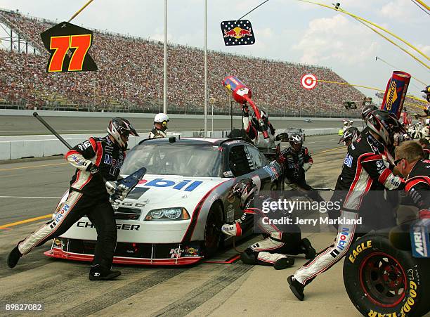 Sam Hornish Jr., driver of the Mobil 1 Dodge makes a pit stop during the NASCAR Sprint Cup Series CARFAX 400 at Michigan International Speedway on...