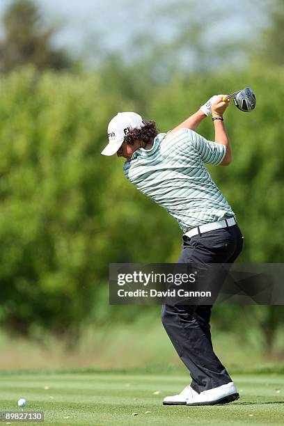 Rory McIlroy of Northern Ireland hits his tee shot on the 12th hole during the final round of the 91st PGA Championship at Hazeltine National Golf...