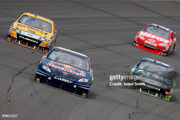 Brian Vickers , driver of the Red Bull Toyota, leads Matt Kenseth , driver of the DEWALT FORD, Carl Edwards , driver of the AFLAC Ford and Tony...