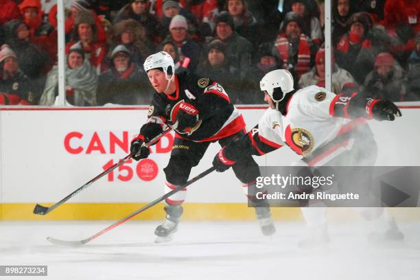 Ottawa Senators alumni Chris Neil gets a pass of with pressure from Radek Bonk during the 2017 Scotiabank NHL100 Classic Ottawa Senators Alumni Game...