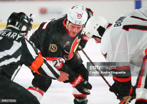 Ottawa Senators alumni Chris Neil faces off against Radek Bonk during the 2017 Scotiabank NHL100 Classic Ottawa Senators Alumni Game on Parliament...