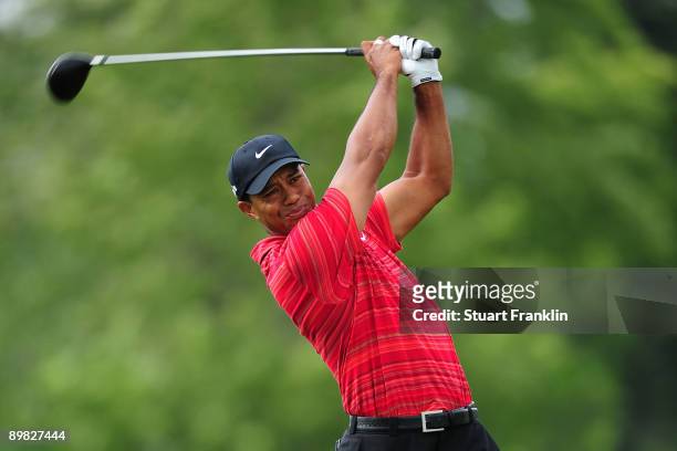 Tiger Woods watches his tee shot on the 12th hole during the final round of the 91st PGA Championship at Hazeltine National Golf Club on August 16,...