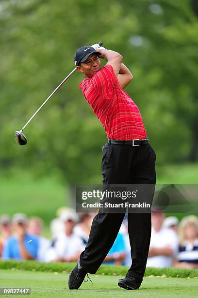 Tiger Woods watches his tee shot on the 12th hole during the final round of the 91st PGA Championship at Hazeltine National Golf Club on August 16,...