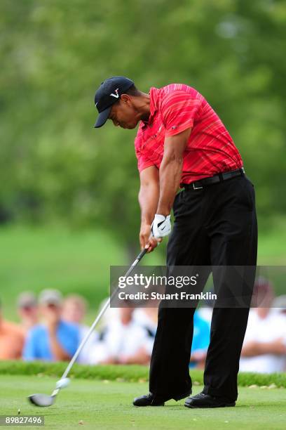 Tiger Woods hits his tee shot on the 12th hole during the final round of the 91st PGA Championship at Hazeltine National Golf Club on August 16, 2009...