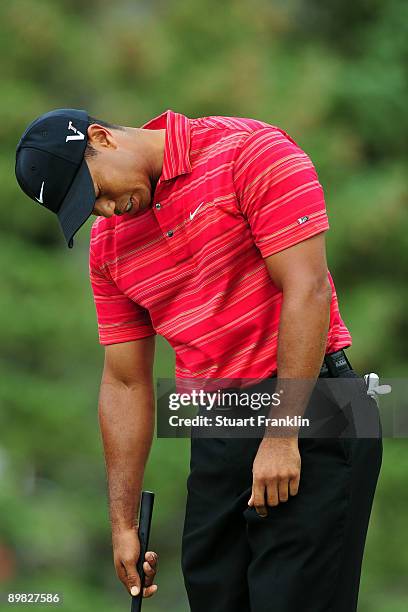 Tiger Woods reacts to a missed putt on the 13th green during the final round of the 91st PGA Championship at Hazeltine National Golf Club on August...