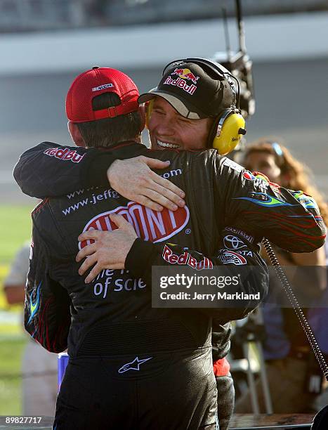 Jeff Gordon, driver of the Dupont Chevrolet, congratulates Brian Vickers , driver of the Red Bull Toyota, after Vickers won the NASCAR Sprint Cup...