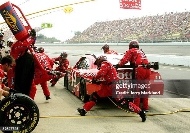 Tony Stewart, driver of the Office Depot Chevrolet makes a pit stop during the NASCAR Sprint Cup Series CARFAX 400 at Michigan International Speedway...