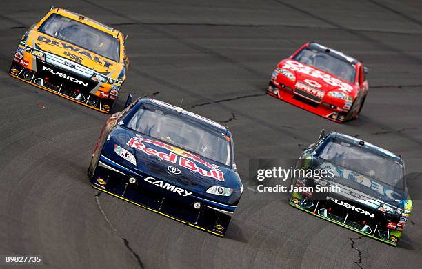 Brian Vickers , driver of the Red Bull Toyota, leads Matt Kenseth , driver of the DEWALT FORD, Carl Edwards , driver of the AFLAC Ford and Tony...