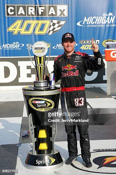 Brian Vickers, driver of the Red Bull Toyota, celebrates in victory lane after winning the NASCAR Sprint Cup Series CARFAX 400 at Michigan...