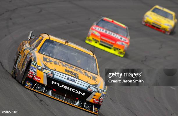 Matt Kenseth, driver of the DeWalt Ford races Jeff Gordon, driver of the DuPont Chevrolet and Clint Bowyer, driver of the Cheerios/Hamburger Helper...