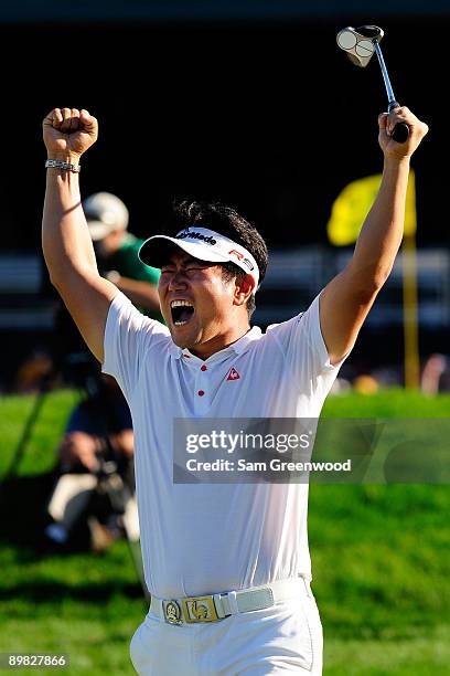 Yang of South Korea celebrates his birdie putt on the 18th green during the final round of the 91st PGA Championship at Hazeltine National Golf Club...