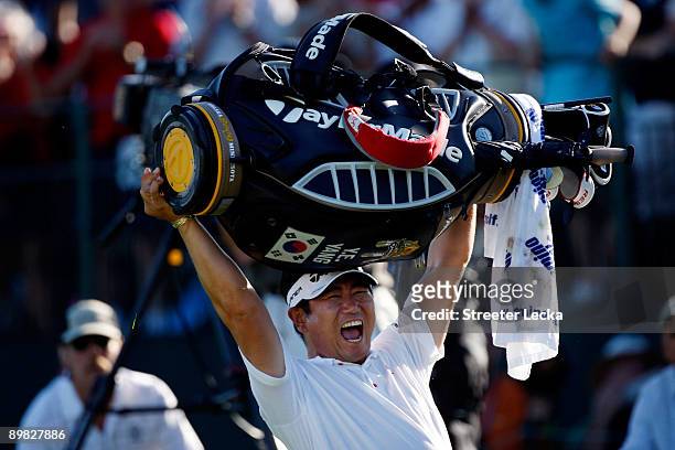 Yang of South Korea celebrates his three-stroke victory on the 18th green during the final round of the 91st PGA Championship at Hazeltine National...