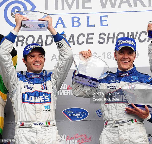 Luis Diaz and Adrian Fernandez drivers of the Lowe's Fernandez Racing Acura, celebrate winning the LMP2 class during the American Le Mans Series Time...