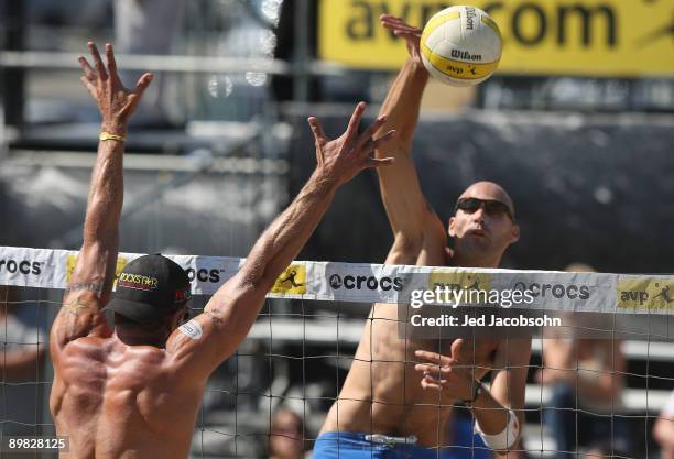 Phil Dalhausser spikes the ball against John Hyden during the finals at the AVP Crocs San Francisco Open on August 16, 2009 at Pier 32 in San...