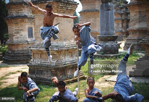 Monks practice kung fu at the Shaolin Temple on the Songshan Mountain on August 15, 2009 in Dengfeng of Henan Province, China. Shaolin Temple, built...